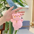Detailed view of pink plush cat keychain with golden bell and embroidered lucky charm - Lucky Charm Tag With Chain / Pink