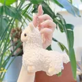 Close-up of a plush white alpaca keychain featuring curly faux fur and silver metal ring - Hanging Chain / Brown / Approx. 12cm