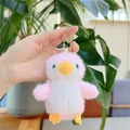 Close-up of fluffy pink penguin plush keychain with soft fur texture and gold ball chain - Hanging Chain / Pink