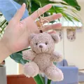 Close-up of curly plush teddy bear keychain in light brown with golden hardware - Gold Clasp / Dark Brown / 11cm