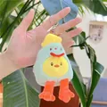 Macro view of cute plush duck keychain with green avocado coat and orange feet held in hand - Green / 14cm Silver Link Chain