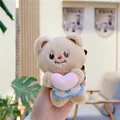 Close-up of cute plush butter bear keychain holding a pink heart with white apron - 11cm Standard Chain / Beige Pink Heart