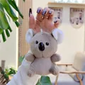 Close-up of a cute plush koala keychain with soft grey fur and silver metal ring - Plain Chain / Brown