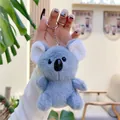 Close-up of a light blue plush koala keychain with soft faux fur and silver metal ring - Plain Chain / Gray