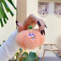Close-up of a soft orange plush fruit keychain held in hand with cute embroidery - 10cm南瓜(普通挂链)