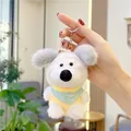 Close-up of white plush dog keychain with blue bib and silver metal ring accessory - Plain Chain / Yellow