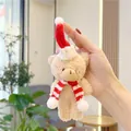 Close-up of a plush Christmas teddy bear keychain with a red knit hat and striped scarf - 11cm / Hanging Chain Style / Brown Red White Scarf
