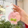 Schattige roze pluche varkenssleutelhanger met groene strik in de hand - Eenvoudige Ketting / Groene Strik