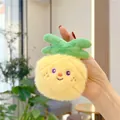 Handheld view of a plush pineapple keychain with soft yellow fur and embroidered face - Gold Metal Buckle / Pineapple (10cm)