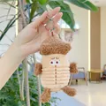Gros plan d'un mignon porte-clés en peluche gland avec une texture douce et fine - Marron