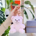 Close-up of pink curly plush teddy bear pendant with golden metal keychain accessory - Gold Clasp / Pink / 11cm