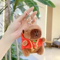 Close-up of brown capybara plush keychain wearing a red strawberry hoodie with gold clasp - Red Hoodie-Metal Buckle / Approx. 11cm