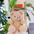 Close-up of curly plush teddy bear keychain in light khaki with soft sherpa texture - No Chain / Tan / 11cm