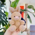 Close-up of a small plush bunny keychain featuring soft brown curly fur and hand-held scale - No Chain / Light Brown Rabbit / 11cm