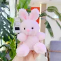 Close-up of a small pink plush bunny keychain held in hand with soft curly fur texture - No Chain / Pink Rabbit / 11cm