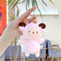 Detailed shot of a pink plush sheep keychain with metal hook and CE certified label - Chain Style / 12cm / Pink