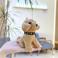 Close-up of a mini plush brown teddy dog keychain with star collar in a hand palm - 11cm Hanging Chain Style / Brown