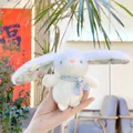 Close-up of white plush bunny keychain with green floral fabric ears and neck scarf - Chain Style / White / Approx. 13cm