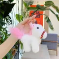 White plush pony keychain with pink mane and gold ring held in hand for mascot display - Gold Metal Buckle / Long Haired White