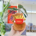 Close-up of a plush capybara wearing a red fries backpack with FRIES embroidery detail - 12cm / With Fries (Bead Chain) / Tan