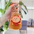 Detail of Capybara plush keychain with burger design and soft brown fur texture - 12cm / With Burger (Golden Clasp) / Tan