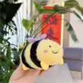 Close-up of a plush bee keychain with soft yellow stripes and purple wings detail - Plain Chain / Purple Wings
