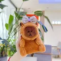 Close-up of cute Capybara plush keychain with a purple bow tie and soft brown texture - Plain Chain / Purple Bowknot