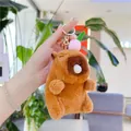 Detailed close-up of a brown plush capybara keychain with a soft fur texture and metal hook - Pink Peach - Bubble Style (Golden Hook)