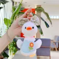 Close-up of cute plush duck keychain with floral bow, lace collar and blue vest - Gold Clasp / 19cm / Blue