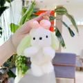 Portachiavi cane in peluche con fiocco rosa e orecchie lunghe su sfondo verde - Verde Con Fermaglio Dorato