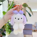 Dettaglio portachiavi a forma di cane di peluche bianco con orecchie e fiocco viola - Viola Con Fermaglio Dorato