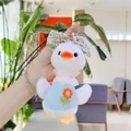 Close-up of plush duck keychain featuring a blue knit sweater and floral bow detail - Hanging Chain Style / 19cm / Blue