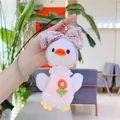 Close-up of plush duck keychain featuring pink sunflower dress and floral bow detail - Hanging Chain Style / 19cm / Pink