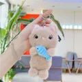 Detail of plush cat keychain holding blue fish with soft khaki fur and metal ring - Khaki (With Chain) / About 15cm