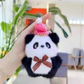 Close-up of plush panda keychain with pink LOVE hat and plaid bow held by hand - Pink Hat (Link Chain)