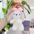 Détail d'un porte-clés chiot en peluche avec nœud rose et fermoir en métal argenté - Khaki Chaîne