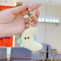 Close-up of plush moon keychain with light blue wings and golden metal clip - Gold Clasp