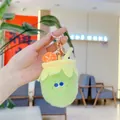 Macro detail of plush drink cup keychain with green fabric and cute embroidery - Milk Tea (Golden Buckle)