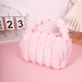 Pink faux rabbit fur makeup bag with soft vertical stripes and plush top handles - Pink