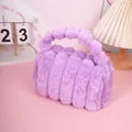 Plush faux rabbit fur makeup bag in purple with striped texture and matching handle - Purple