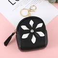 Mini black backpack coin purse with sunflower design and golden keychain clip - Black