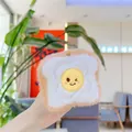Cute plush toast slice pendant with fried egg emoji detail and soft brown fur - Toast Bread (Chain)