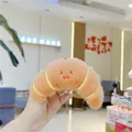 Cute croissant plush keychain with smiley face and caramel brown fabric for bags - Croissant (Chain)
