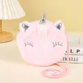 Close-up of plush unicorn shoulder bag featuring pink faux fur and silver horn detail - Pink (Sharp Horn)