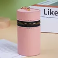 Pink cylinder mini purse in textured faux leather with gold zipper and hook detail - Pink