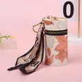 Dettaglio mini borsa a secchiello floreale con hardware dorato e sciarpa di seta - Rosa (A221)