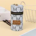 Macro view of blue leather mini bucket pouch with metal hook and monogram patterns - Blue