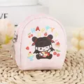 Dettaglio di una mini borsa a quadretti rosa con bambina cartoon e scritta HAPPY - Rosa (A281 Nezha)