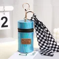 Close-up of holographic blue cylinder pouch with metal zipper and checkerboard silk scarf - Blue (A240)
