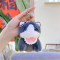 Close-up of cute grey plush kitten keychain with pink sunglasses and lace bib - Hanging Chain Style / Navy Blue